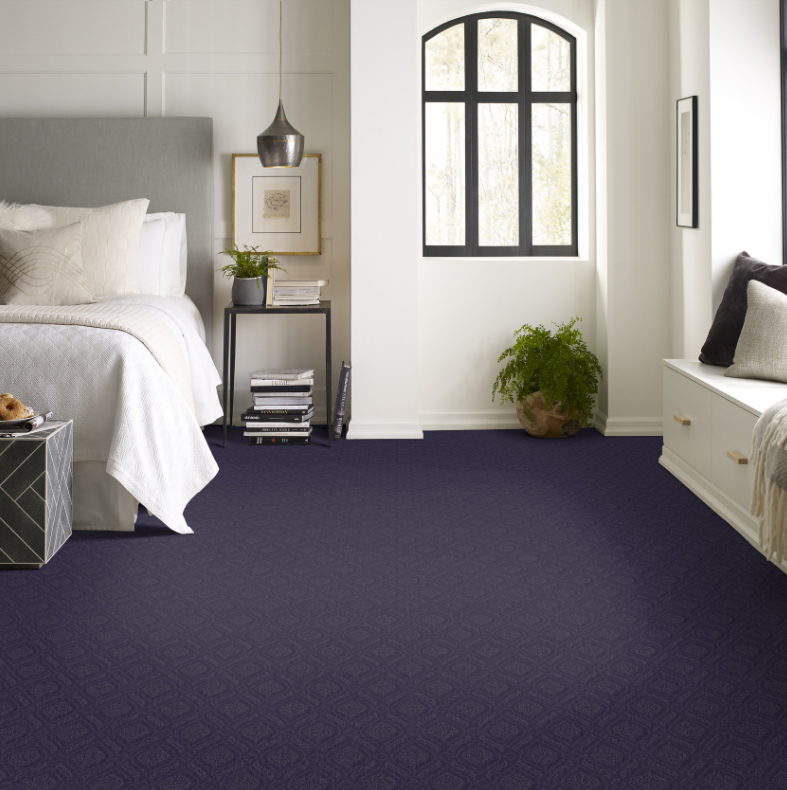 Blue Purple carpet in bedroom with cream walls