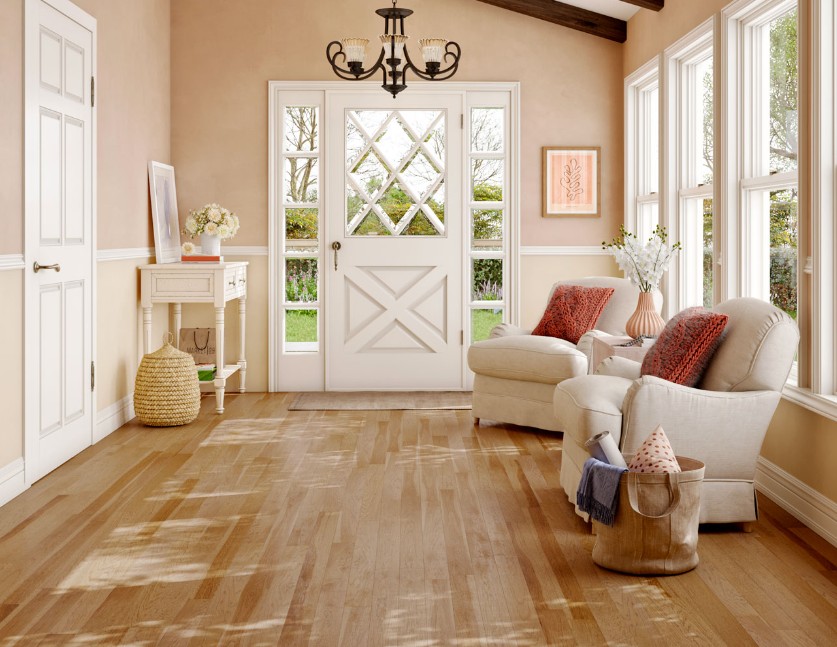 Barn style flooring in home with chandelier