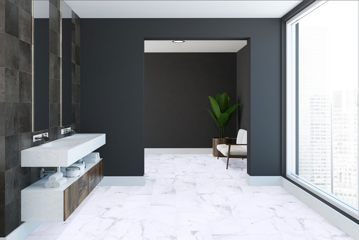 Modern style bathroom with white lvp flooring with marble detail