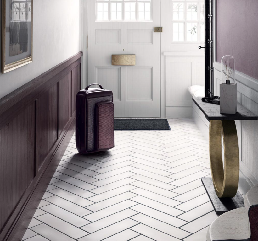 Herringbone pattern white tile on bathroom floor
