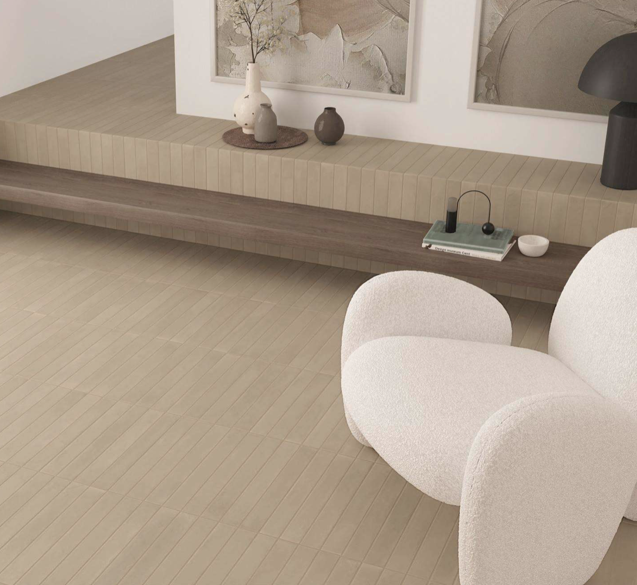 Minimalist living room with white chair and tile detail on the floor