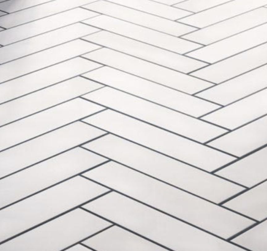 Close up of herringbone white tile